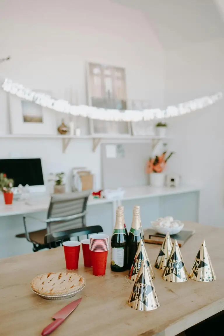A cheerful office party setup with New Year decorations, snacks, and sparkling beverages. corporate diakosmisi party 3